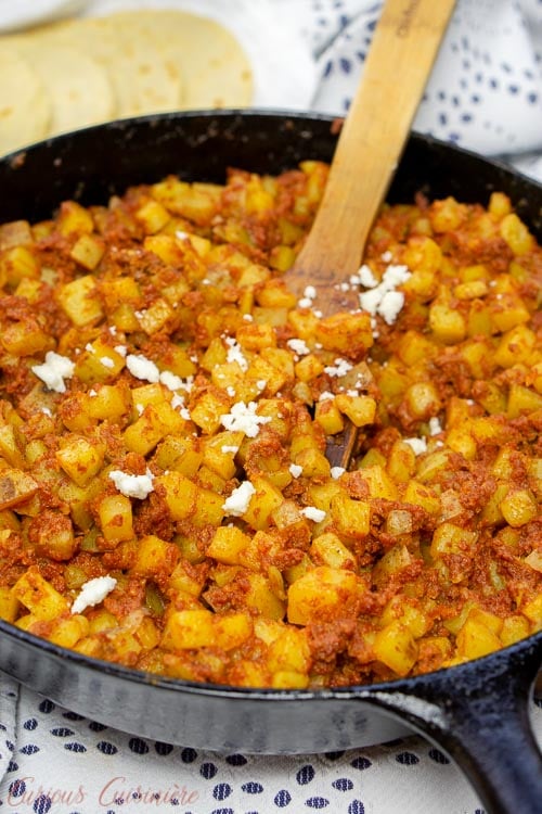 A cast iron skillet of Chorizo con Papas
