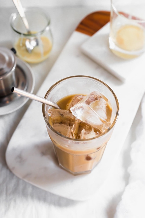 Tall glass of Vietnamese iced coffee with sweetened condensed milk and ice
