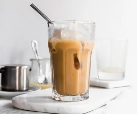Tall glass of Vietnamese iced coffee horizontal image