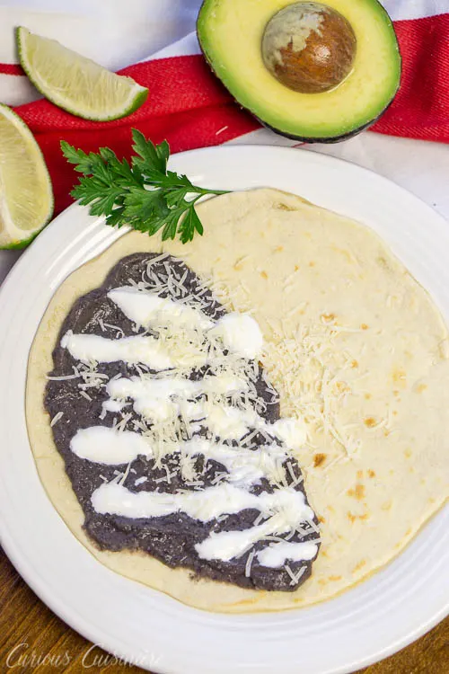 Honduran Baleadas Bean Tortillas served with cheese and cream
