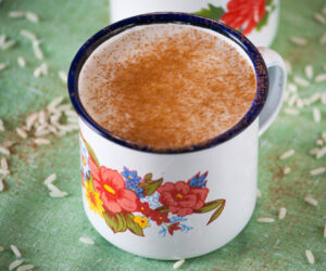 A floral mug of Guatemalan Atolillo Hot Rice Atole Drink