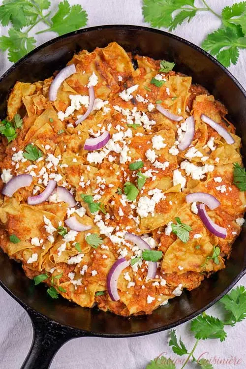 A skillet of chilaquiles rojos