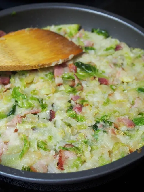 Cooking Bubble and Squeak (British Potato Cakes) on the first side