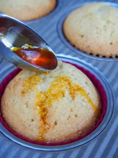 Adding saffron drizzle to Persian Love Cake Cupcakes