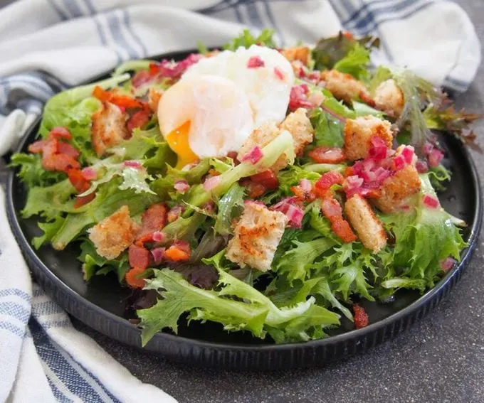 Salade Lyonnaise (Warm Bacon and Egg Salad) with frisee and croutons