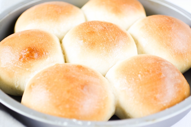 Baked Honduran Coconut Bread Pan de Coco golden in the pan