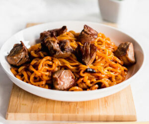 Jjapaguri - Korean Noodle Dish in a white bowl