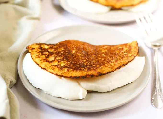 Cachapas (Venezuelan corn pancakes) with soft cheese