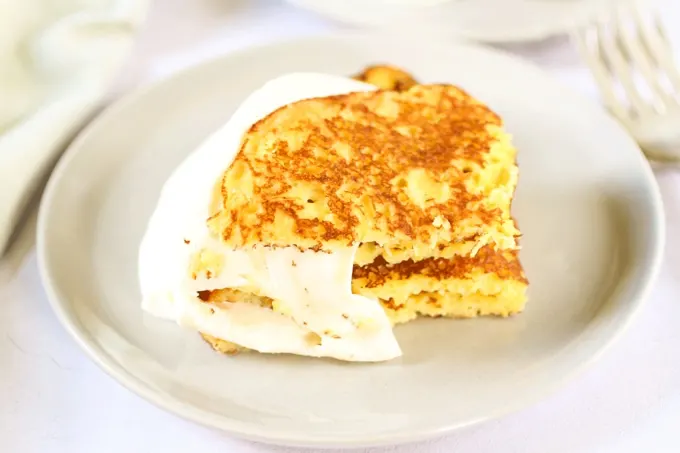 Cachapas (Venezuelan corn pancakes) with soft cheese, cut shot
