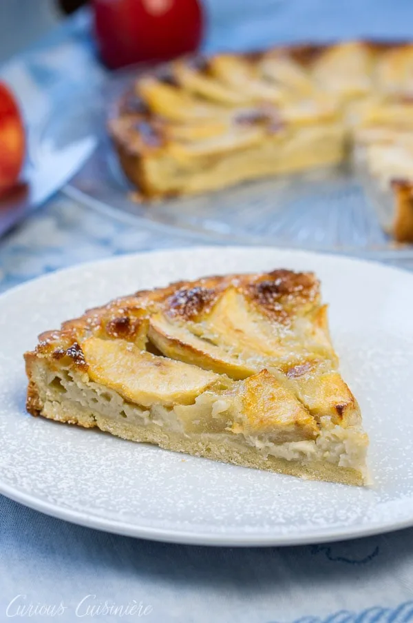 Slice of Tarte Normande (French Apple Tart)