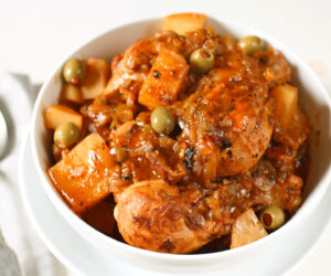 Cuban Chicken Fricassee in a white bowl