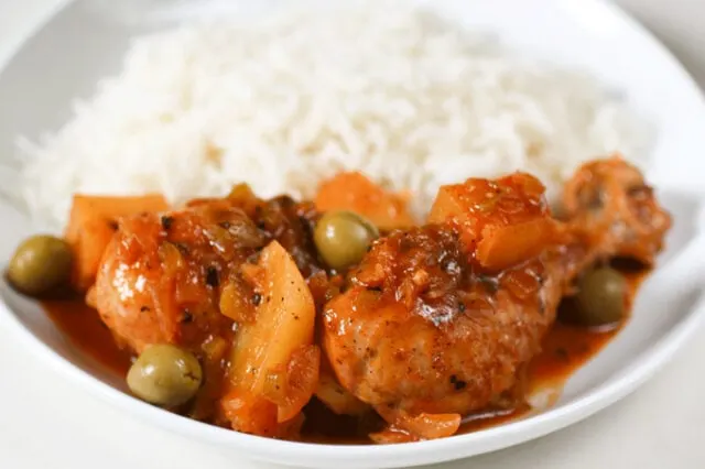 Cuban Chicken Fricassee - chicken leg and rice up close