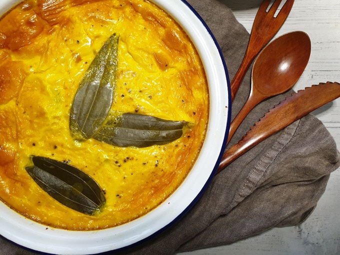 South African beef bobotie topped with bay leaves
