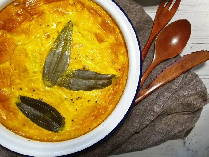 South African beef bobotie topped with bay leaves