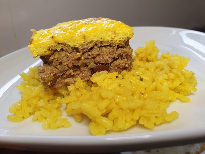 South African beef bobotie served with yellow rice