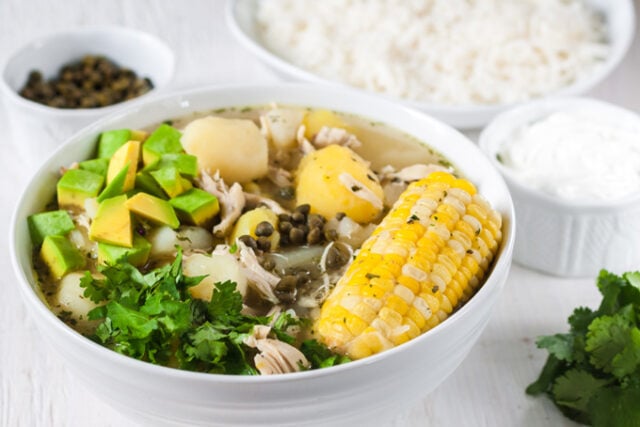 Colombian Ajiaco chicken stew with cilantro and avocado