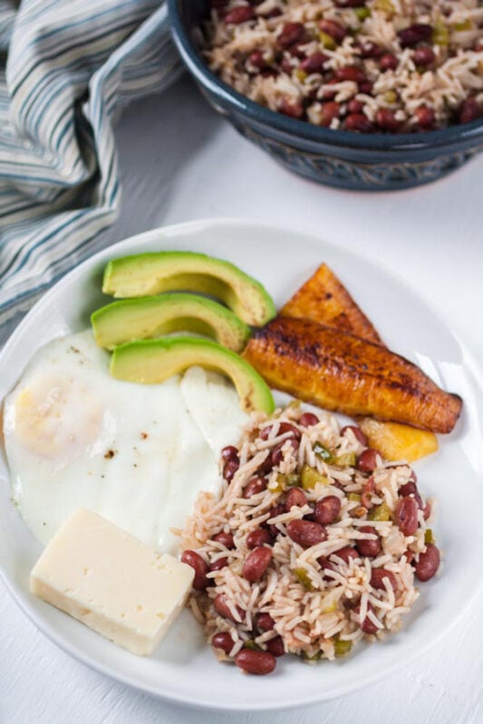 Casamiento Salvadoreno (Salvadoran Beans and Rice) served with avocado and eggs