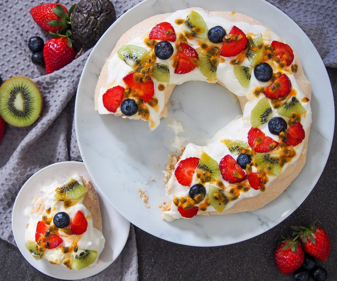 Australian Christmas Pavlova wreath with a slice out