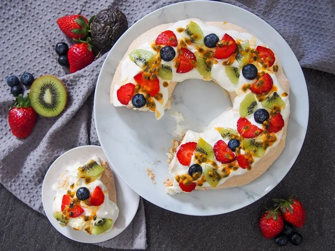 Australian Christmas Pavlova wreath with a slice out