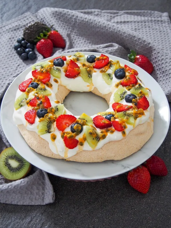 New Zealand Christmas Pavlova wreath surrounded by fruit