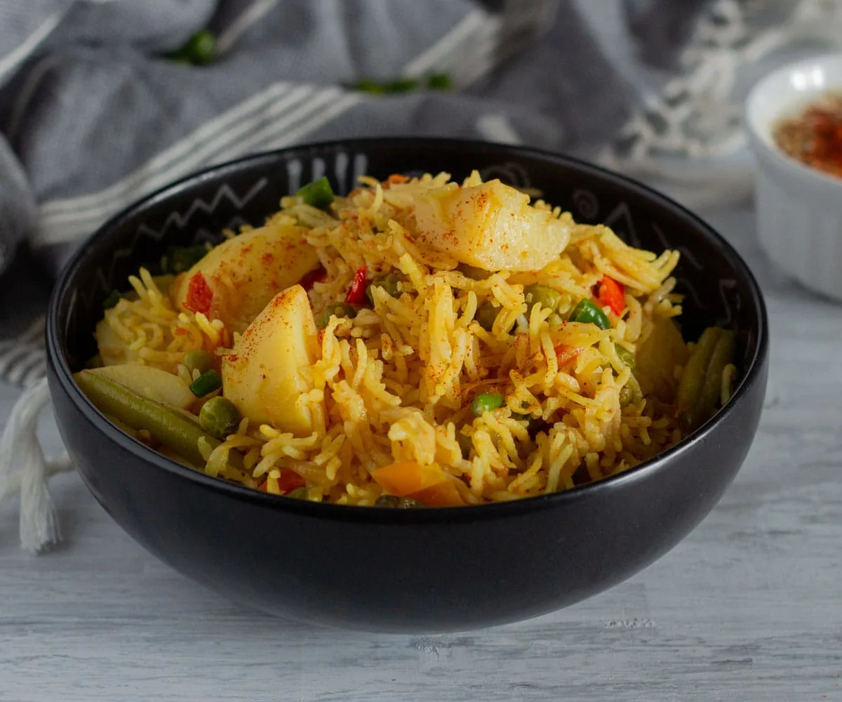 Vegetable Tehri (North Indian Vegetable Spiced Rice) with potatoes and peas