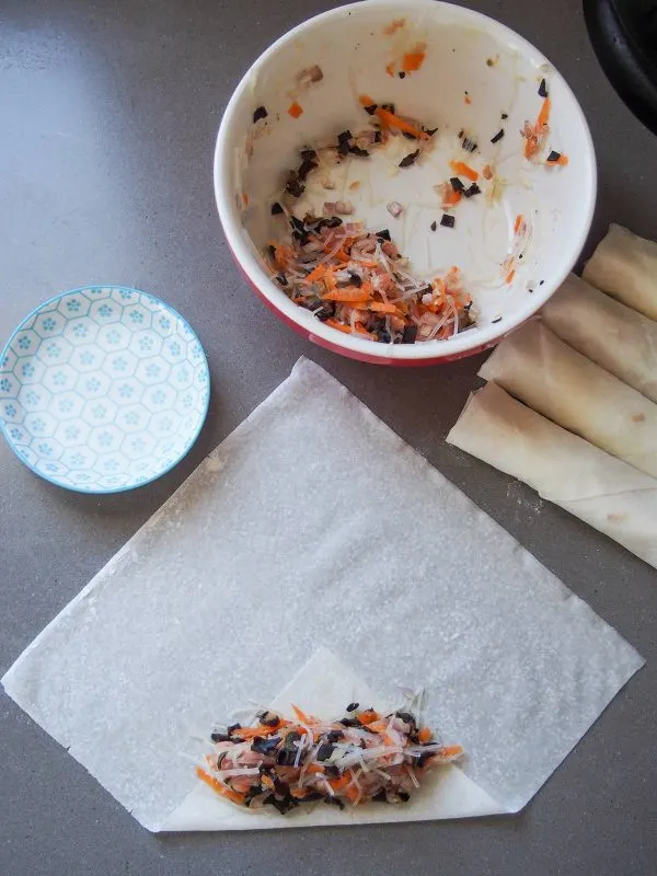 Adding filling to Vietnamese Spring Rolls - Cha Gio