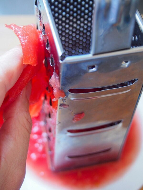 Grating tomato for Fasolakia - Greek Green Beans 