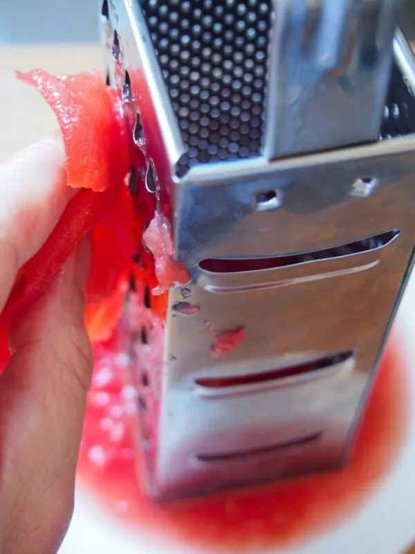 Grating tomato for Fasolakia - Greek Green Beans 