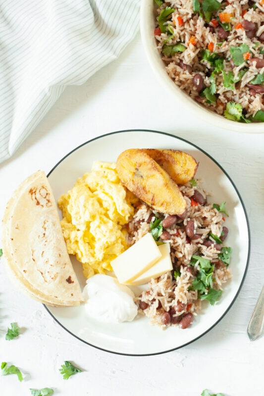 Gallo Pinto (Rice and Beans) for breakfast with eggs, tortilla, and fried plantains