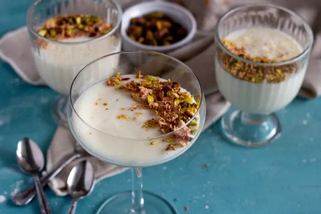 Muhallebi - Middle Eastern milk pudding topped with nuts and rose petals