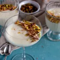 Mahalabia - Middle Eastern milk pudding topped with nuts and rose petals