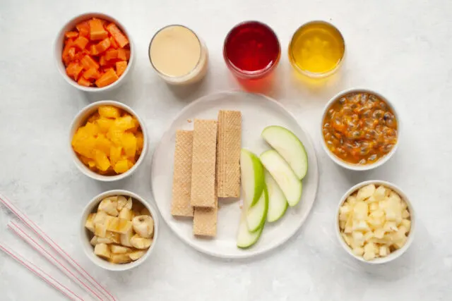 Ingredients for Cholados (Colombian shaved ice with fruit and condensed milk)