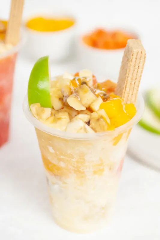 Cholados (Colombian snow cones with fruit and condensed milk) with passionfruit syrup