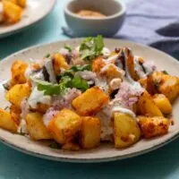 Alloo Chaat - plate of curried potatoes - cropped image