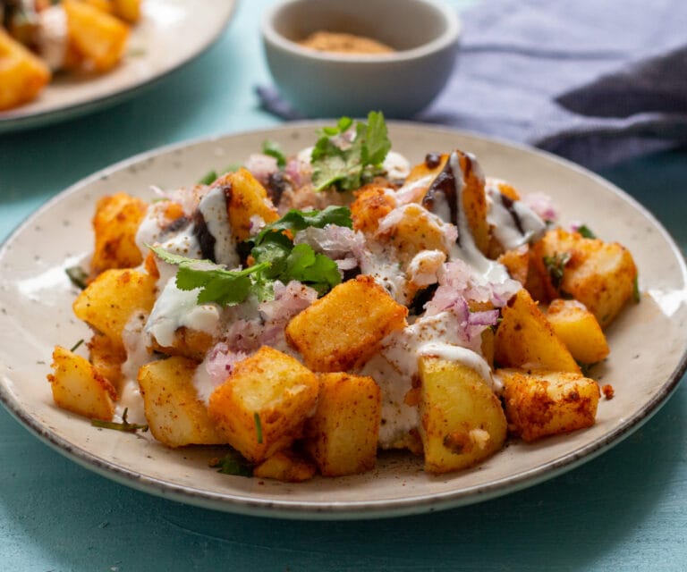 Alloo Chaat - plate of curried potatoes - cropped image