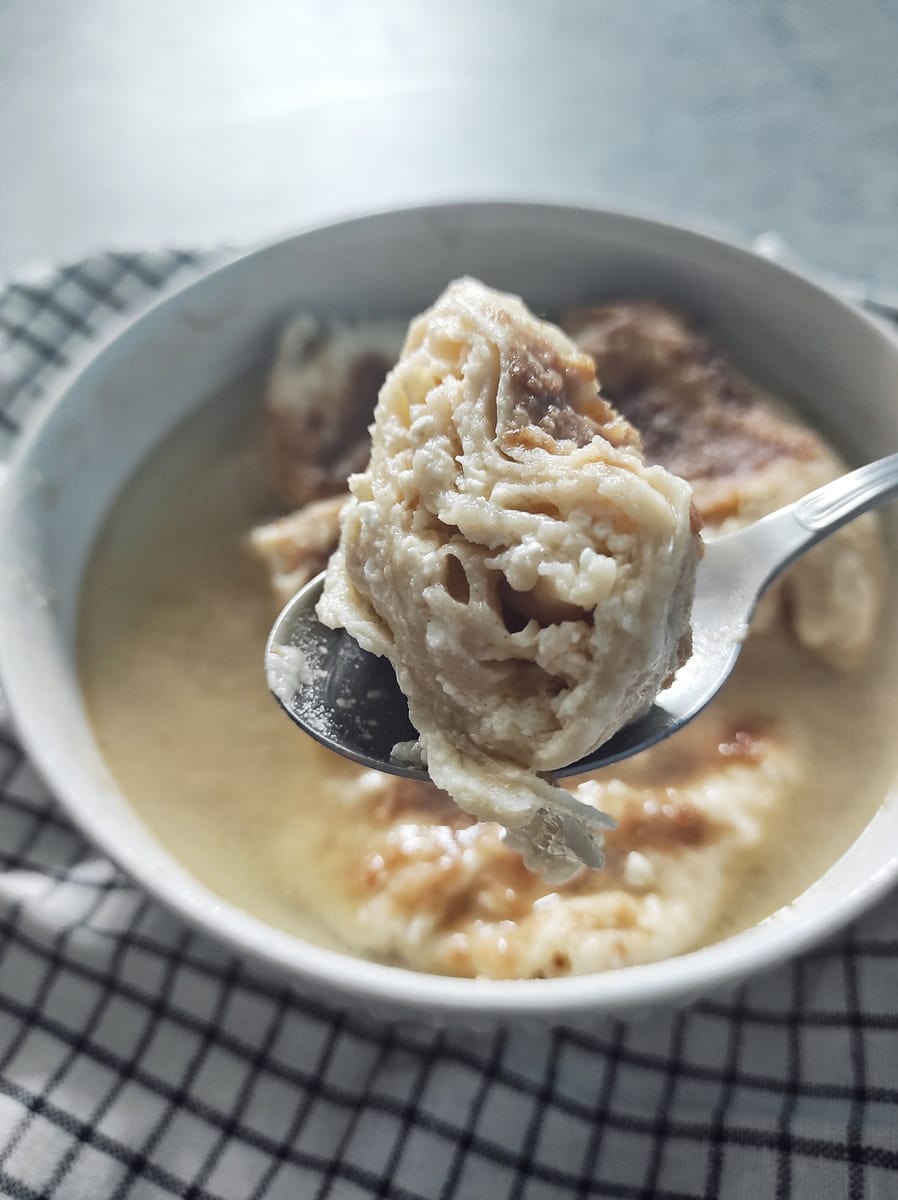 One Zagorski Štrukli on a spoon (Croatian Cheese Dumplings)