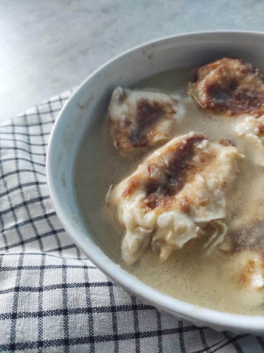 A bowl of Zagorski Štrukli Served in Soup (Croatian Cheese Dumpling Soup)