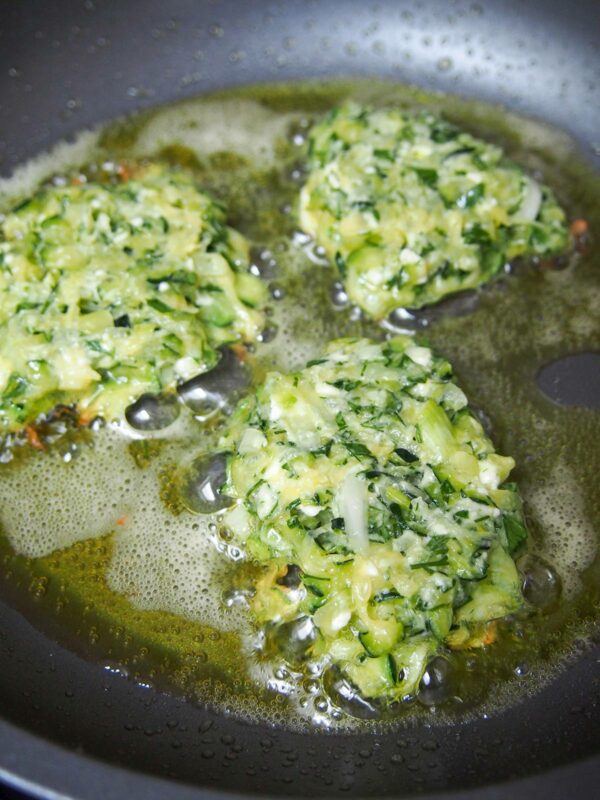 Frying Kolokithokeftedes (Greek Zucchini Fritters)