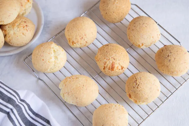 Pan de Yuca - Ecuadorian Cassava Cheese Bread on a cooling rack