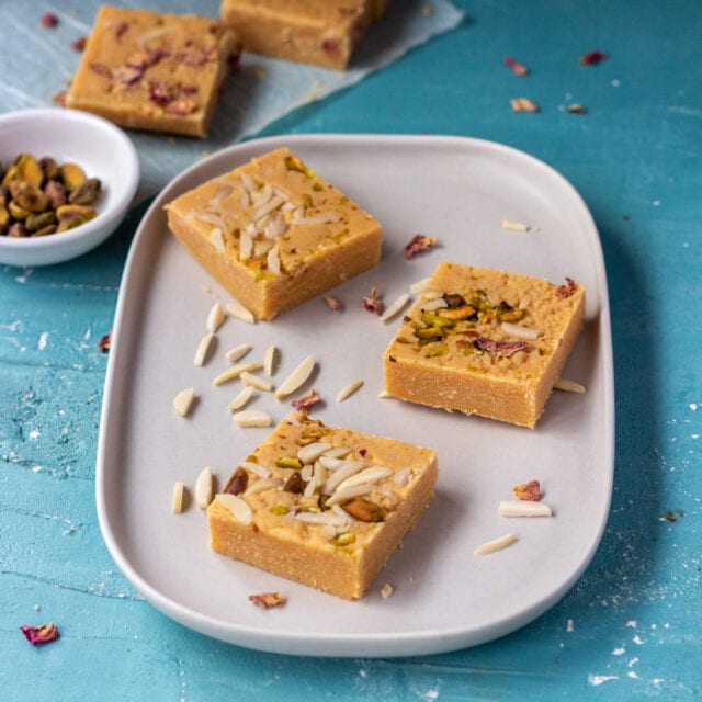 Barfi - Indian Milk Powder Barfi Recipe topped with pistachios 