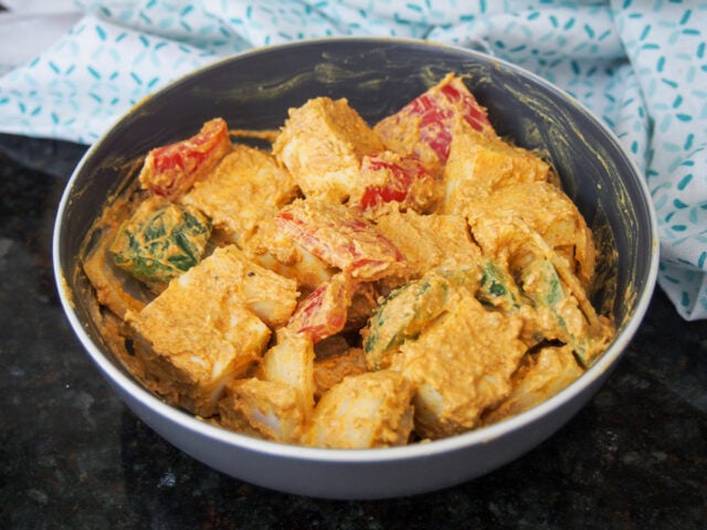 Marinating the cheese and vegetables for Paneer Tikka 