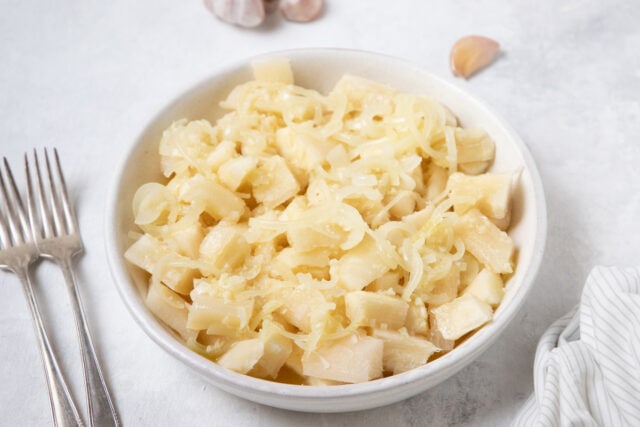 Cuban Yuca con Mojo - Cassava with garlic sauce in a serving bowl