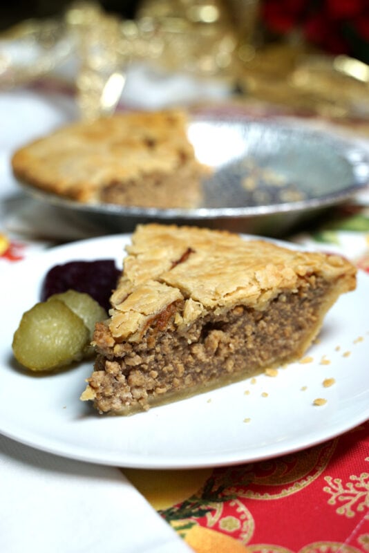 Tourtiere French Canadian Pork Pie slice with pickles