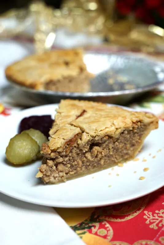 Tourtiere French Canadian Pork Pie slice with pickles