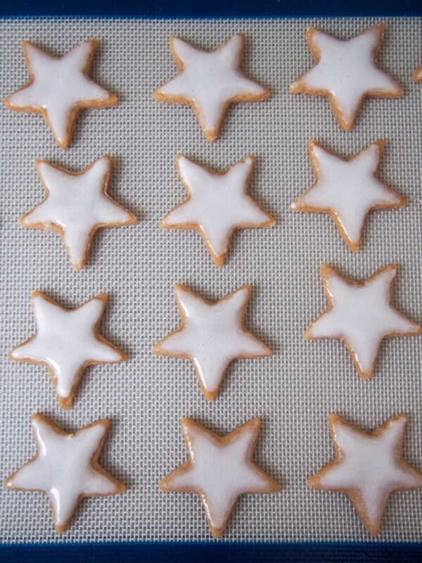 Zimtsterne German cinnamon stars with topping, ready to bake
