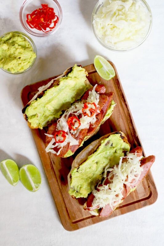 Guatemalan Shucos Hot Dogs with guacamole and cabbage