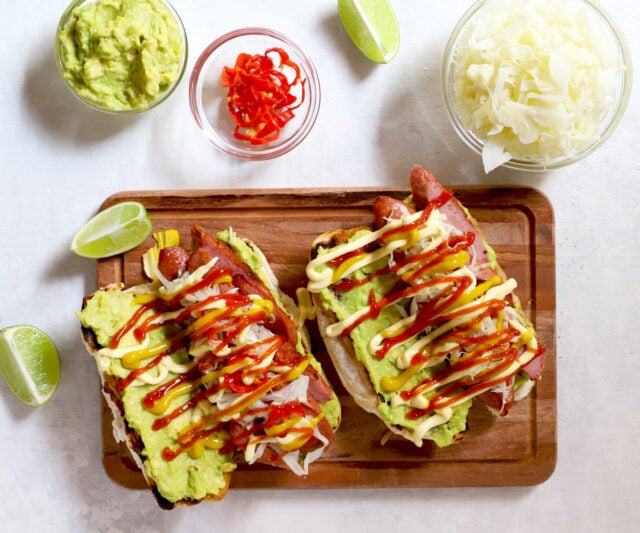 Guatemalan Shucos Hot Dogs with guacamole and ketchup