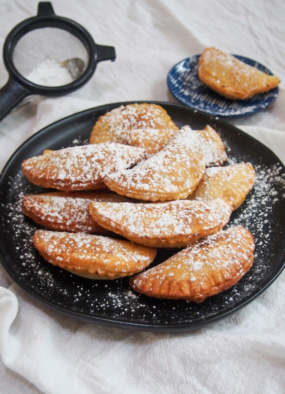 Ravioli dolce - sweet ravioli fried and topped with powdered sugar