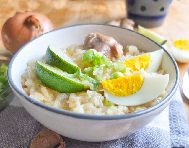 Chicken Arroz Caldo Filipino Rice Porridge with lime and eggs