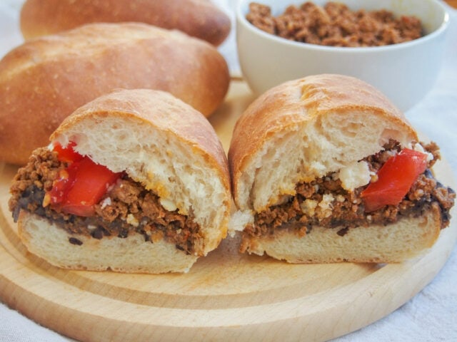 Two halves of a Mexican chorizo torta